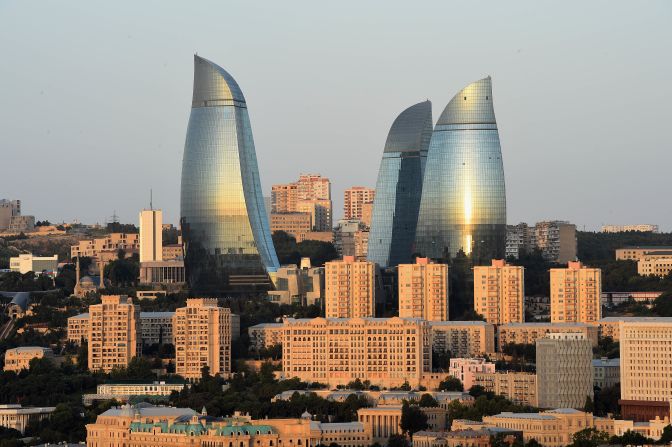 The Flame Towers are 190 meters high and were <a href="http://edition.cnn.com/2012/09/26/world/asia/great-buildings-barry-hughes/">completed by global architecture giant HOK</a>.  