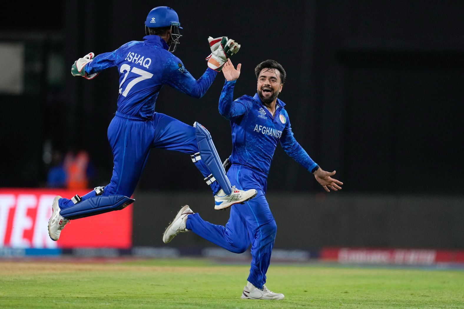 Afghanistan captain Rashid Khan is congratulated by teammate Mohammad Ishaq, left, after dismissing Bangladesh's Rishad Hossain during cricket’s T20 World Cup on Monday, June 24. Afghanistan would go on to make the semifinals of the tournament, <a href="https://www.cnn.com/2024/06/26/sport/afghanistan-historic-semifinal-t20-cricket-world-cup-spt-intl/index.html">a historic success for the team</a>, before losing to South Africa.