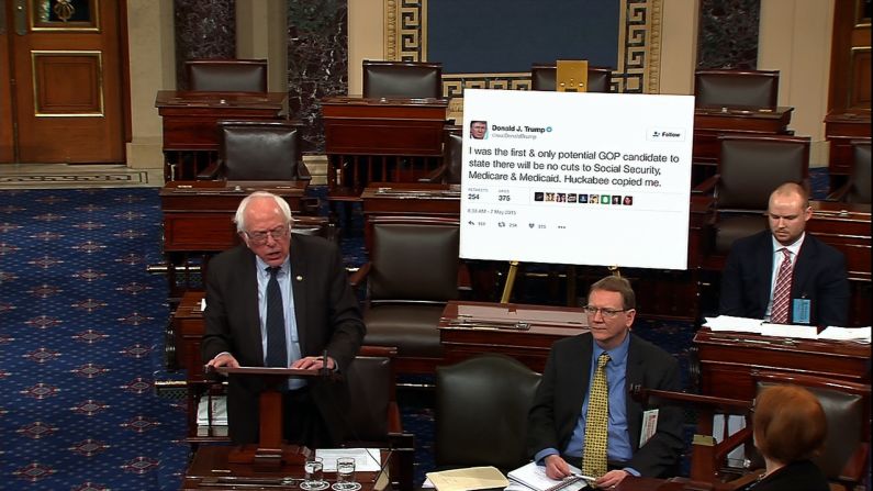 Sanders <a href="http://www.cnn.com/videos/politics/2017/01/05/bernie-sanders-trump-tweet-poster-senate-sot.cnn" target="_blank">brings a giant printout of one of Donald Trump's tweets</a> to a Senate debate in January 2017. In the tweet, Trump had promised not to cut Social Security, Medicare and Medicaid.