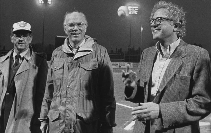 Sanders, right, tosses a baseball before a minor-league game in Vermont in 1984. US Sen. Patrick Leahy, center, was also on hand.