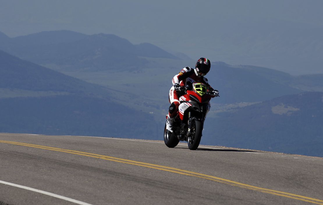 COLORADO SPRINGS, COLORADO - AUGUST 12:  Ducati rider Carlin Dunne makes his way to the finish during the Pikes Peak International Hill Climb on August 12, 2012 in Colorado Springs, Colorado. The race takes place over a 12.42 mile course with 156 corners finishing at 14,110 feet at the summit of Pikes Peak. (Photo by Rainier Ehrhardt/Getty Images)