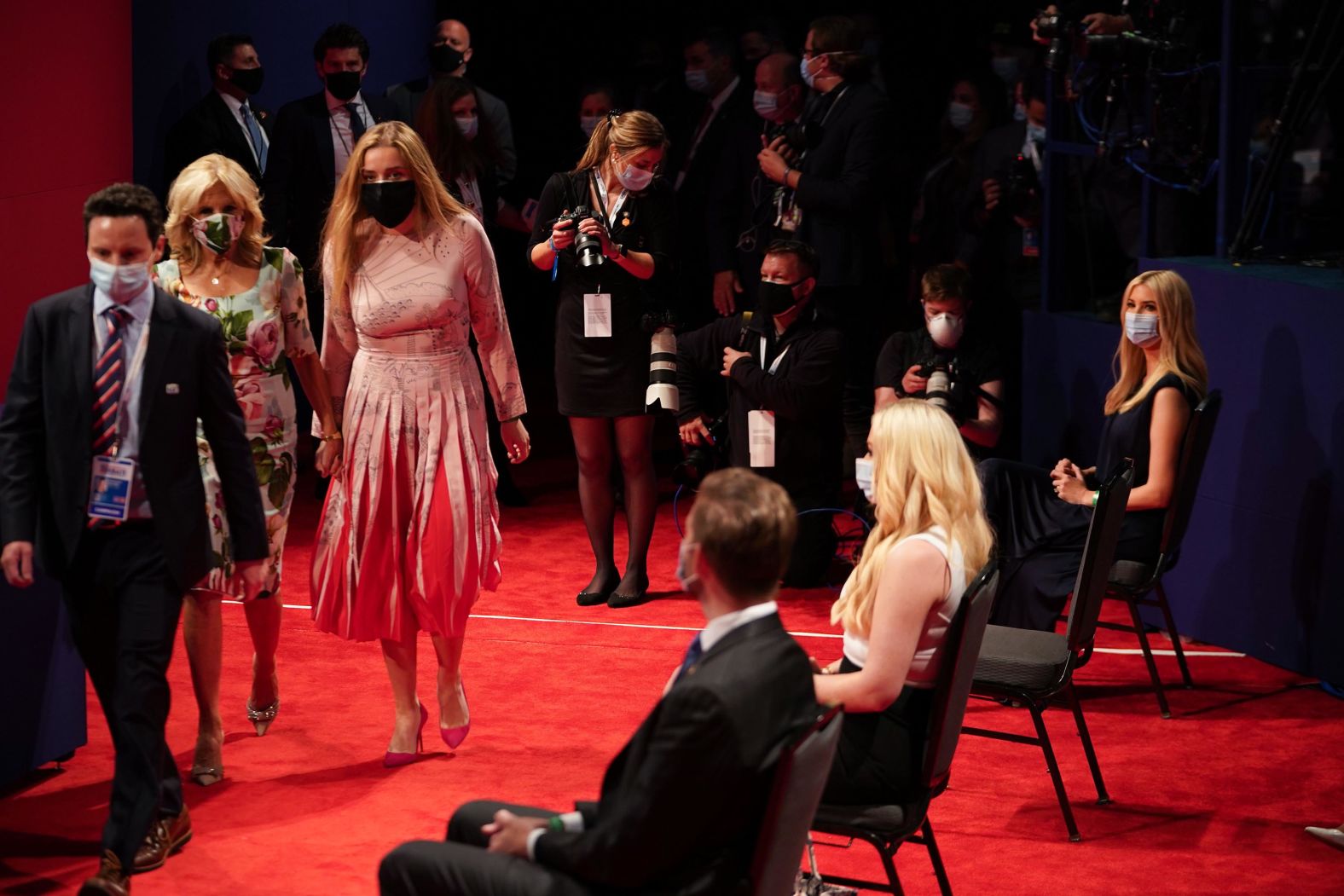 Biden's wife, Jill, second from left, walks by some of Trump's children as they attend the debate.