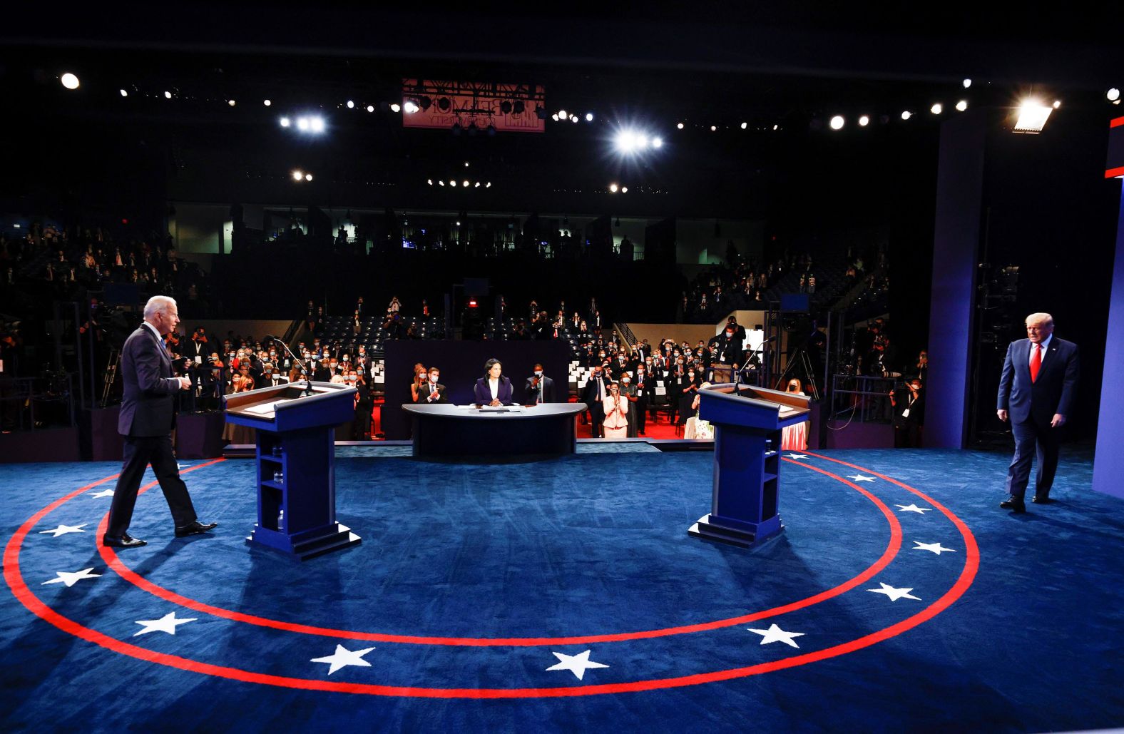 Biden and Trump arrive on stage at the start of the debate.