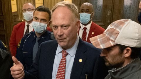 Matt Maddock a Republican member of the Michigan House of Representatives speaks with protesters shortly after a vote to approve the extension of Governor Gretchen Whitmer's emergency declaration/stay-at-home order due to the coronavirus disease (COVID-19) outbreak at the state capitol building in Lansing, Michigan, U.S. April 30, 2020.  REUTERS/Seth Herald