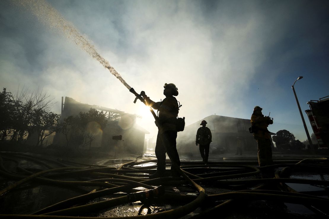 Firefighters respond to the Sycamore Fire in Whittier, California, in 2022. Insurers are pulling out of California because of wildfire risks.