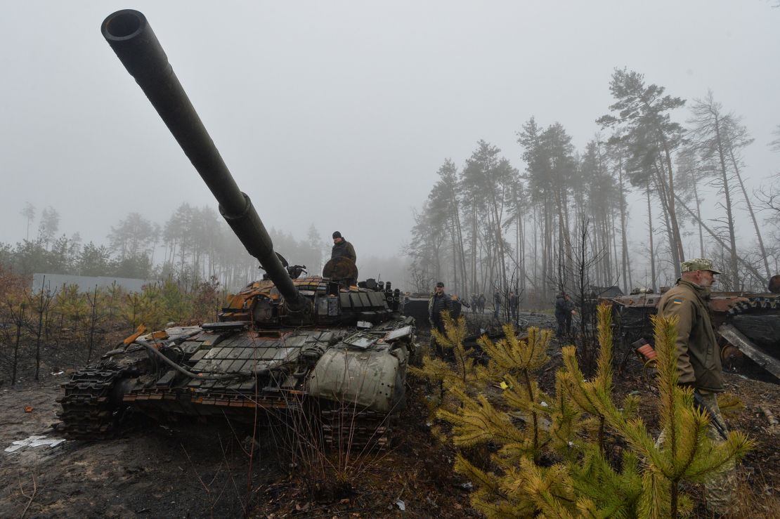 Ukrainian service members and locals inspect destroyed Russian military vehicles, as Russia's attack on Ukraine continues, in the village of Dmytrivka in Kyiv region, Ukraine April 1, 2022.