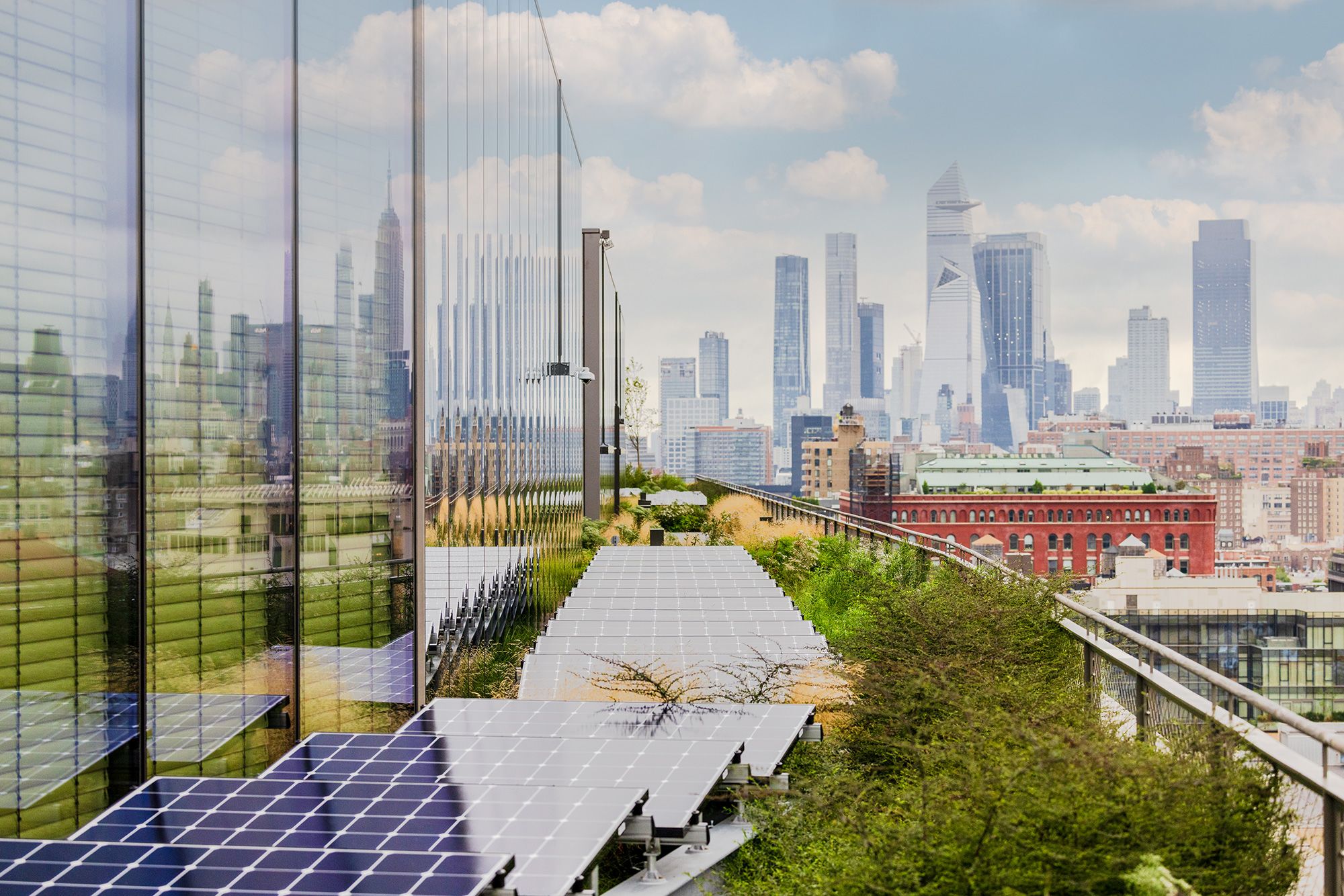 The building features solar panels and a rainwater retention system.