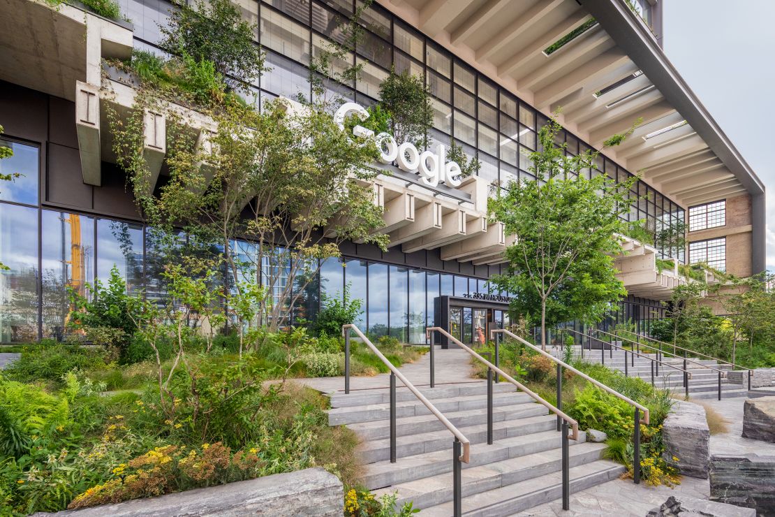 The main entrance exposes part of the original rail lines, using them as part of a floating planter that reveals part of the building's history.