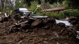 A car sits on top of a pile of debris during a rain storm in Studio City, California, on February 5, 2024.