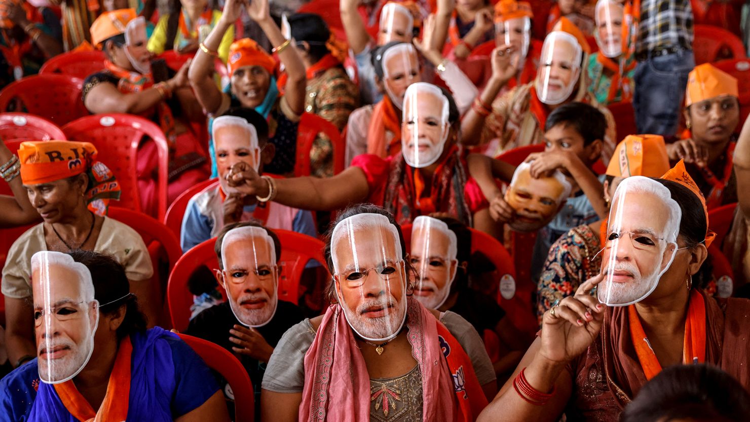 Supporters of India's Prime Minister Narendra Modi wear masks of his face, as they attend an election campaign rally in Meerut, on March 31.