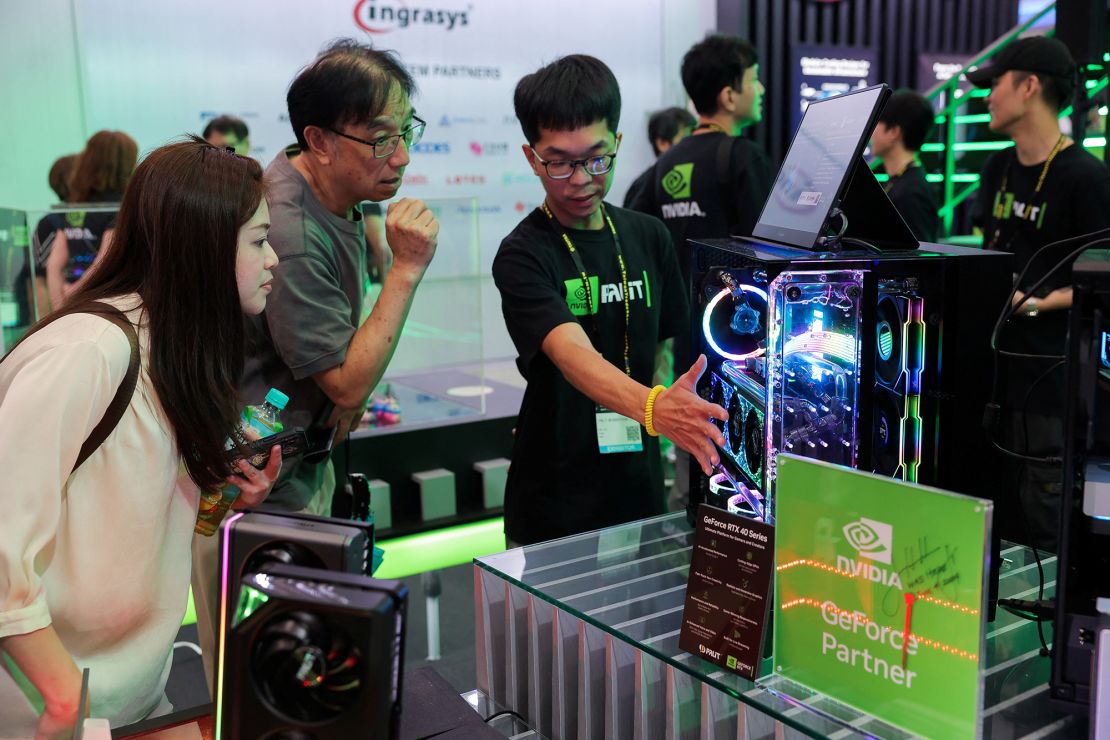 Staff introduce Nvidia GeForce series equipment on display at Computex in Taipei, Taiwan, on June 5.
