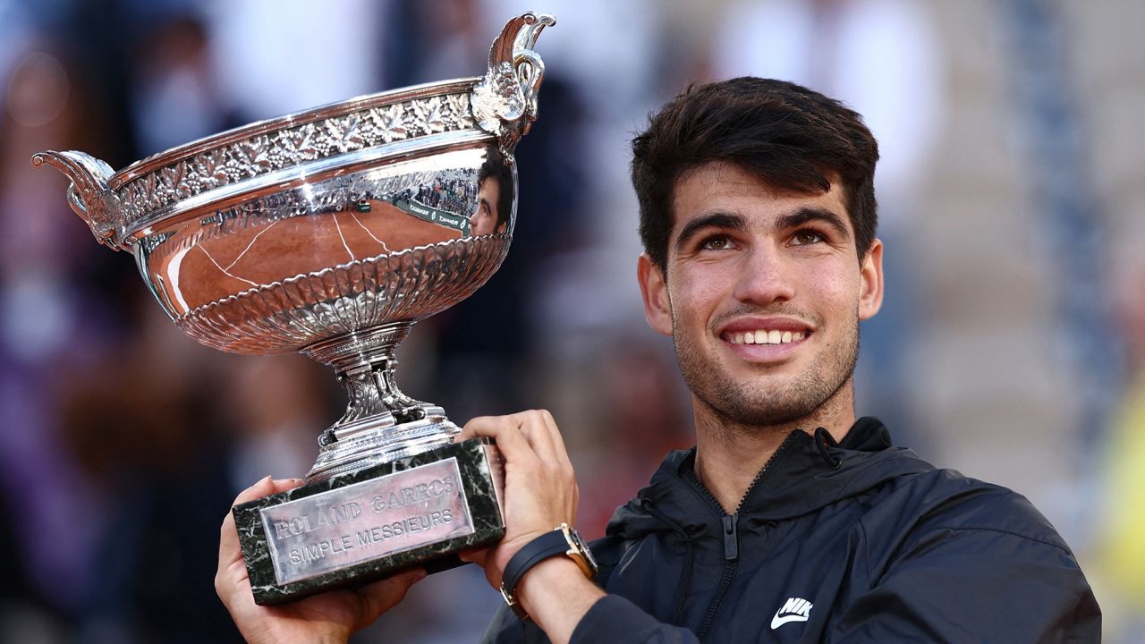 Tennis - French Open - Roland Garros, Paris, France - June 9, 2024
Spain's Carlos Alcaraz celebrates with the trophy after winning the men's singles final against Germany's Alexander Zverev REUTERS/Yves Herman