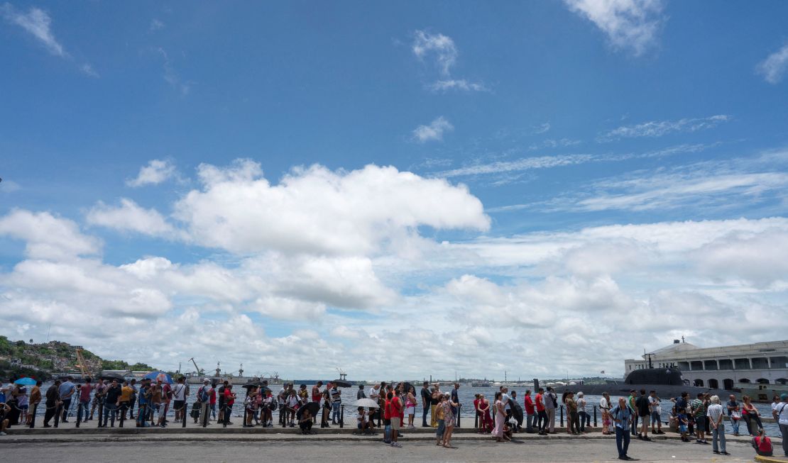 People line up to visit Russian frigate Admiral Gorshkov (not pictured) docked in Havana's bay, Cuba, June 13, 2024.