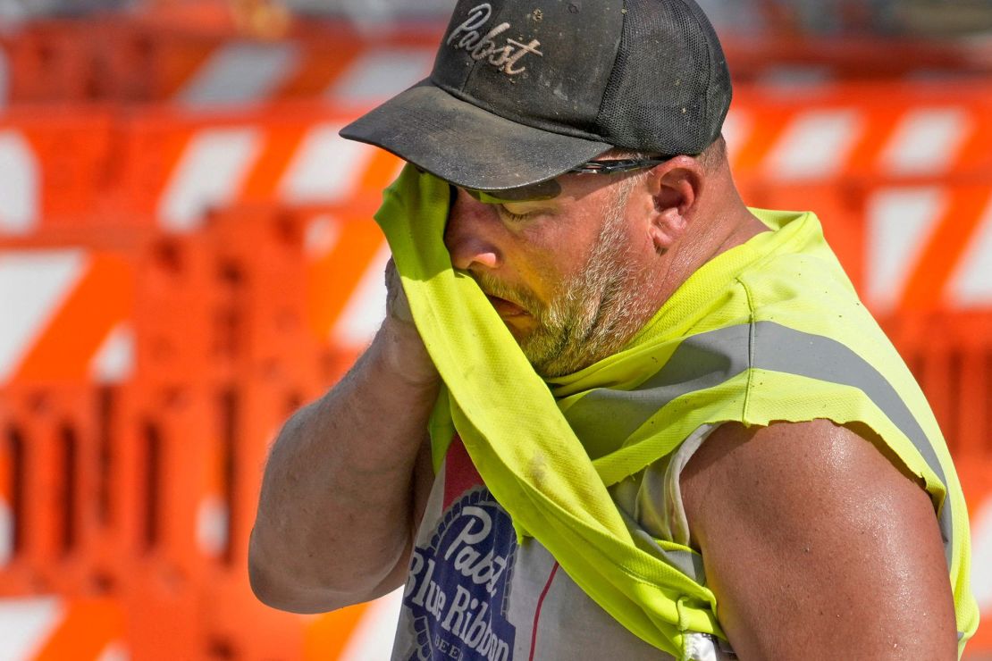 Jeff Nerby, with Arrow-Crete Construction, on a hot and humid day while working in Milwaukee, Wisconsin on June 17, 2024.