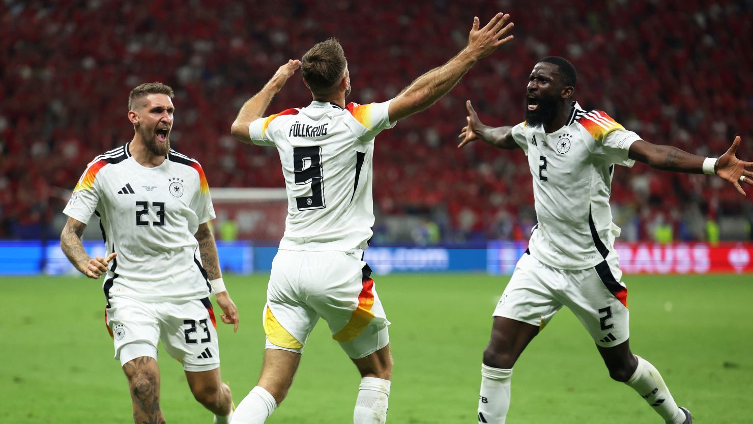 Germany's Niclas Füllkrug celebrates scoring against Switzerland.