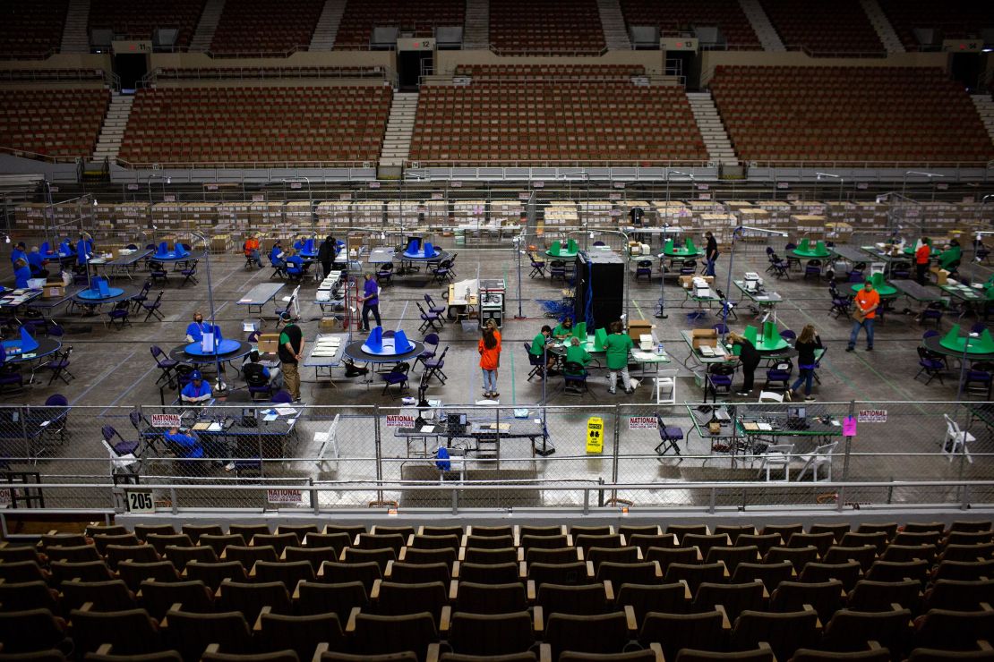 Contractors working for Cyber Ninjas, which was hired by the Arizona State Senate, examine and recount ballots from the 2020 general election on May 3, 2021 in Phoenix, Arizona. 