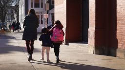 Parents pick up their children from Hawthorne Scholastic Academy following their first day of in-person learning on March 01, 2021 in Chicago, Illinois. Students in kindergarten through fifth grade began in-person learning today as the city continues to phase in a return to the classroom after nearly a year's hiatus and a lengthy battle with the teacher's union brought on by COVID-19 concerns. 