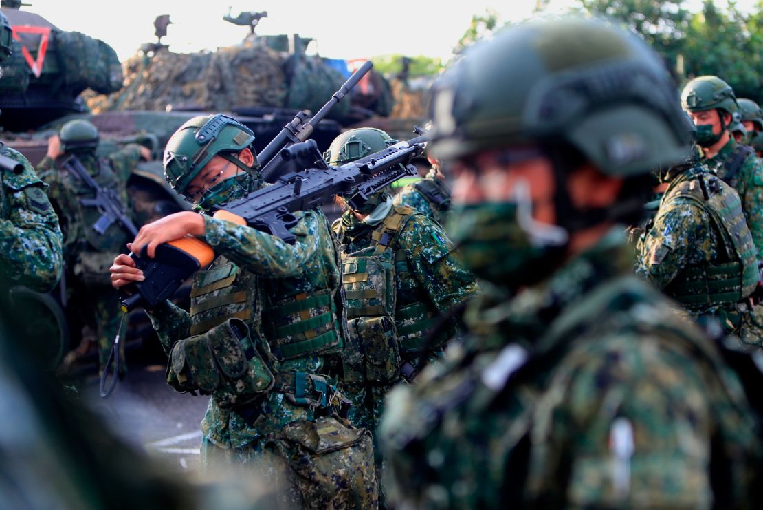 Taiwanese soldiers prepare grenade launchers, machine guns and tanks in a drill preparing for a Chinese invasion in Tainan, Taiwan, on September 16, 2021.