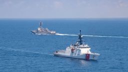 FILE - In this Aug. 27, 2021, file photo provided by U.S. Coast Guard, Legend-class U.S. Coast Guard National Security Cutter Munro (WMSL 755) transits the Taiwan Strait during a routine transit with Arleigh Burke class guided-missile destroyer USS Kidd (DDG 100). The United States and China are stepping up their war of words over Taiwan in a long-simmering dispute that has significant implications for the power dynamic in the Indo-Pacific and beyond. (U.S. Coast Guard via AP, File)