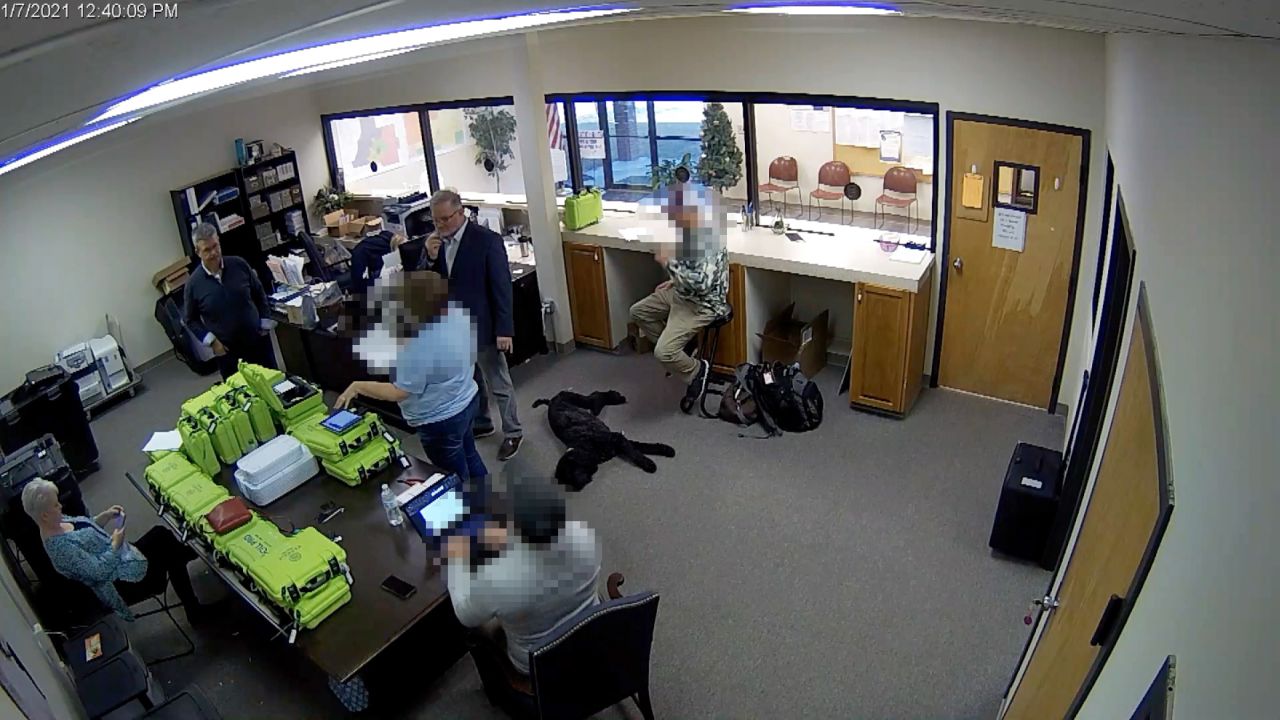 Newly obtained surveillance video shows a Republican county official and a team of operatives working for Trump 2020 attorney Sidney Powell inside a restricted area of the elections office in Coffee County Georgia. Portions of this image were obscured to protect the identity of people unnamed in the report. 