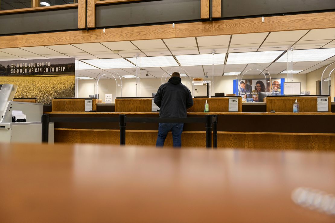 Tanner DeLapp, of The Bail Project, picks up cash on March 9 to bail out three clients in Tulsa, Oklahoma. 