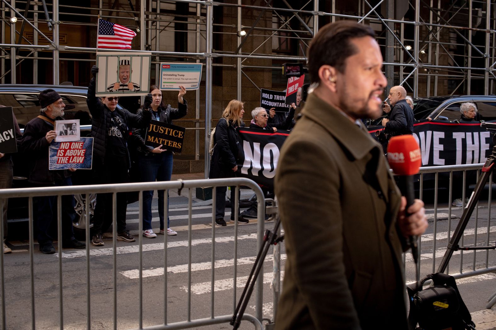 Reporters and demonstrators are posted outside Trump Tower after news broke of Trump's indictment on March 30, 2023.