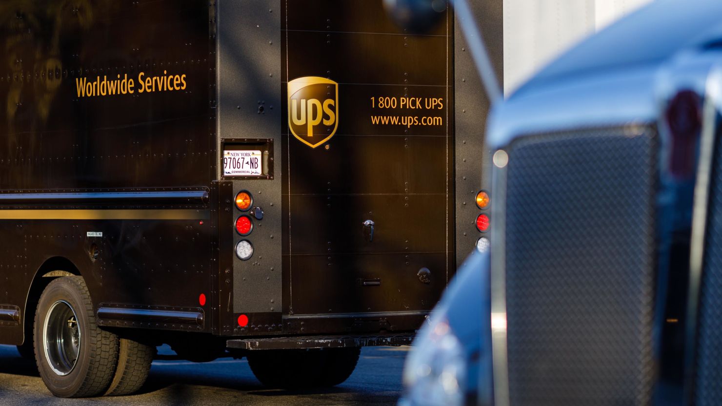 Delivery trucks parked outside a UPS hub in Brooklyn.