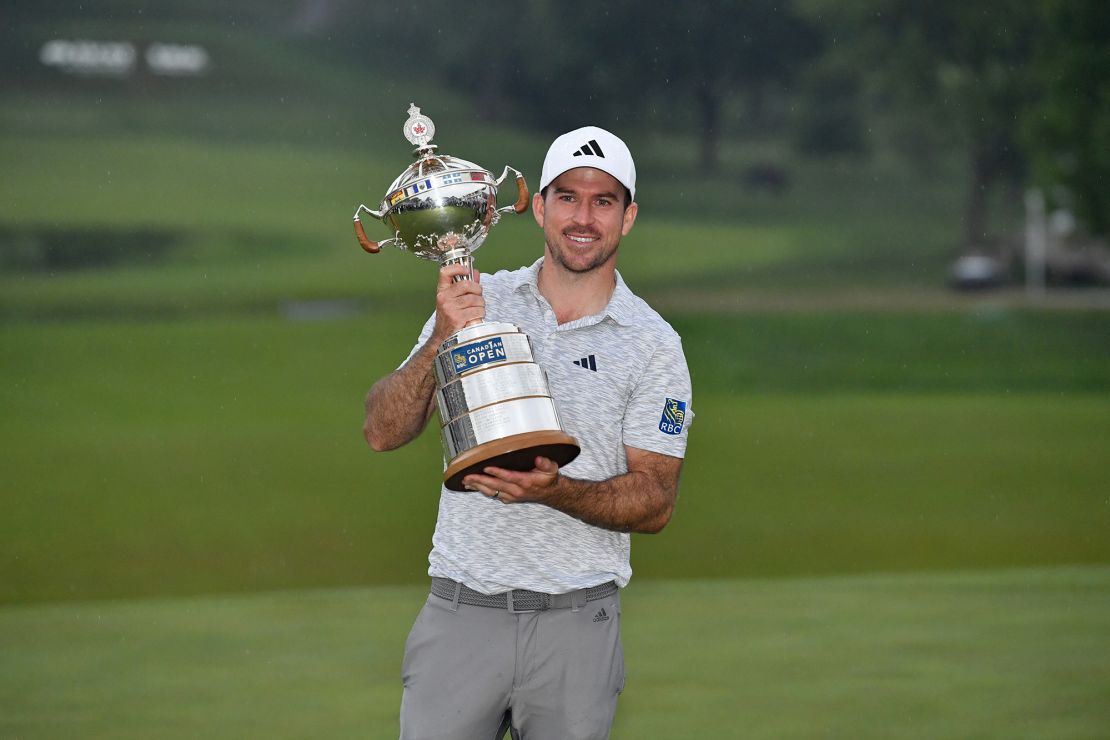 Taylor poses with the trophy.