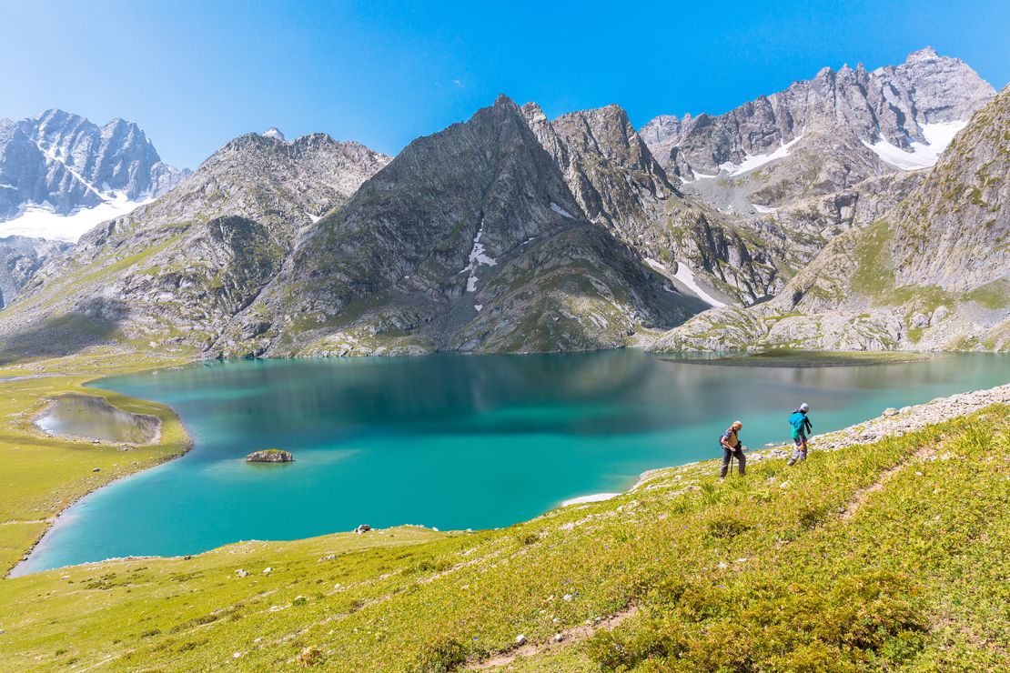 Sonamarg,India - August 15 2017 : Trekkers Hike along the beautiful Kishansar lake on the Kashmir Great Lakes trek in Sonamarg, India. Most serene trek in the Himalayas with glacial lakes & valleys