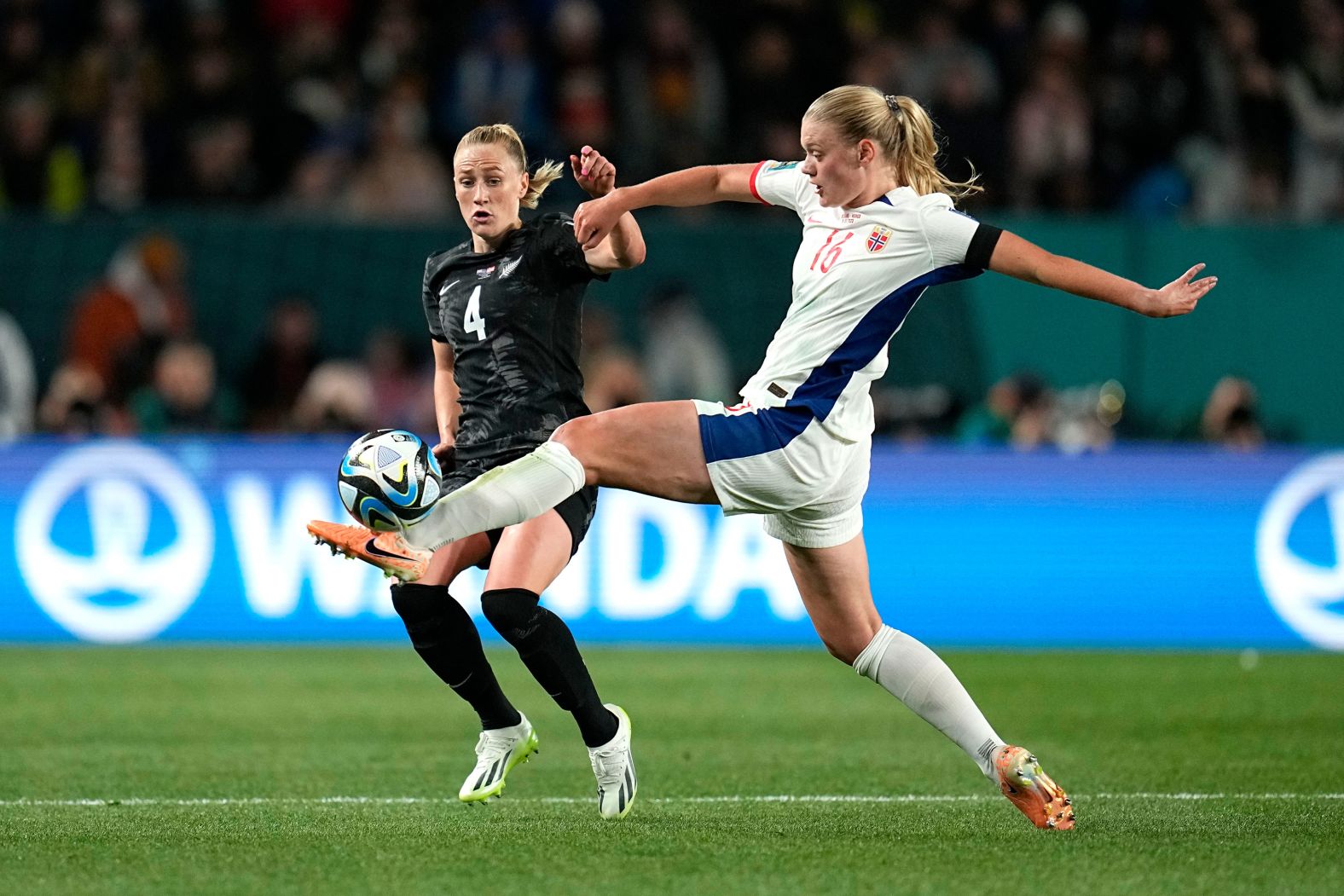 New Zealand's CJ Bott, left, and Norway's Mathilde Harviken vie for the ball.