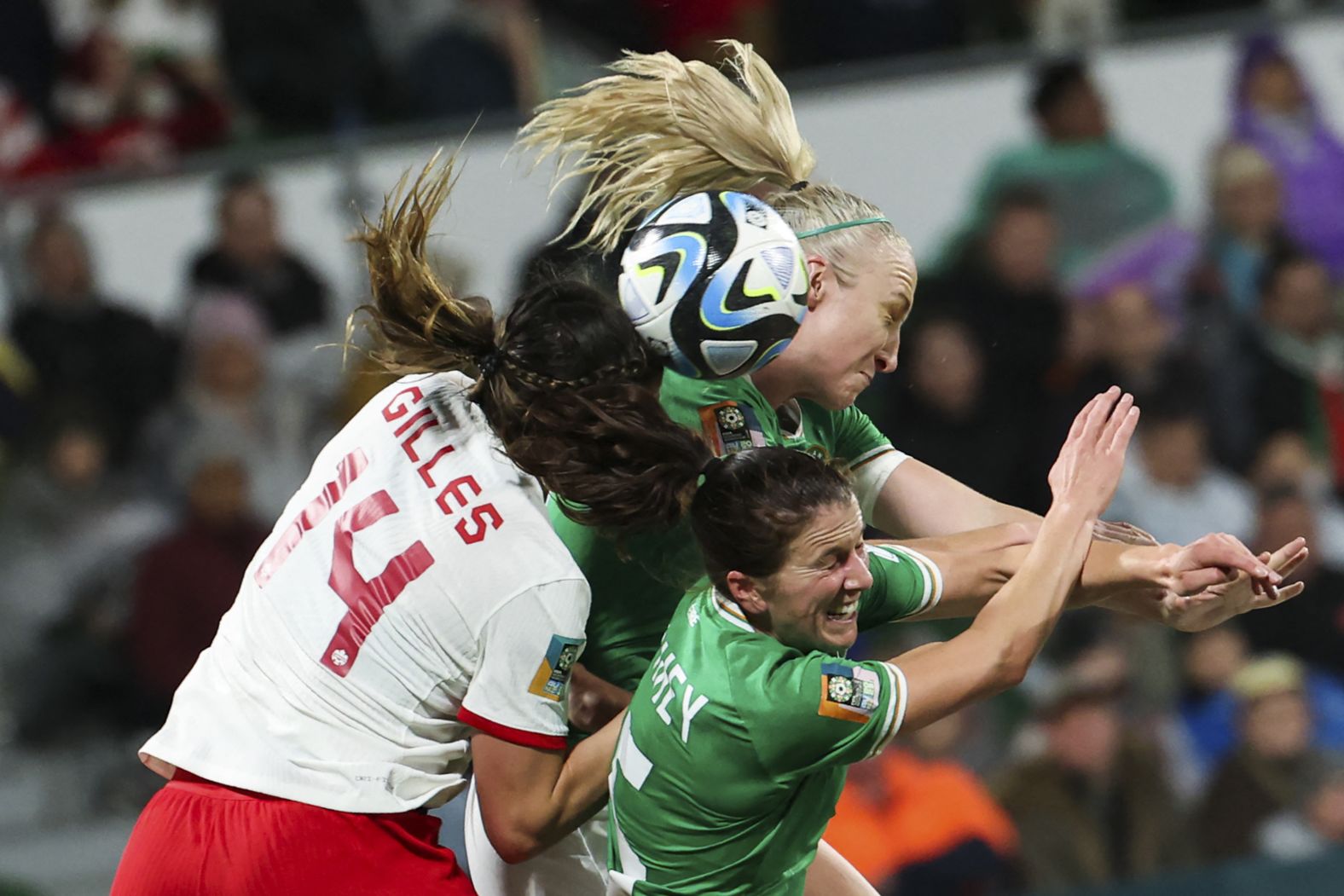 Canada's Vanessa Gilles competes for a header with Ireland's Niamh Fahey, bottom, and Louise Quinn during a match on July 26. <a href="https://www.cnn.com/2023/07/25/football/canada-spain-japan-2023-womens-world-cup-spt-intl/index.html" target="_blank">Canada won 2-1</a>.