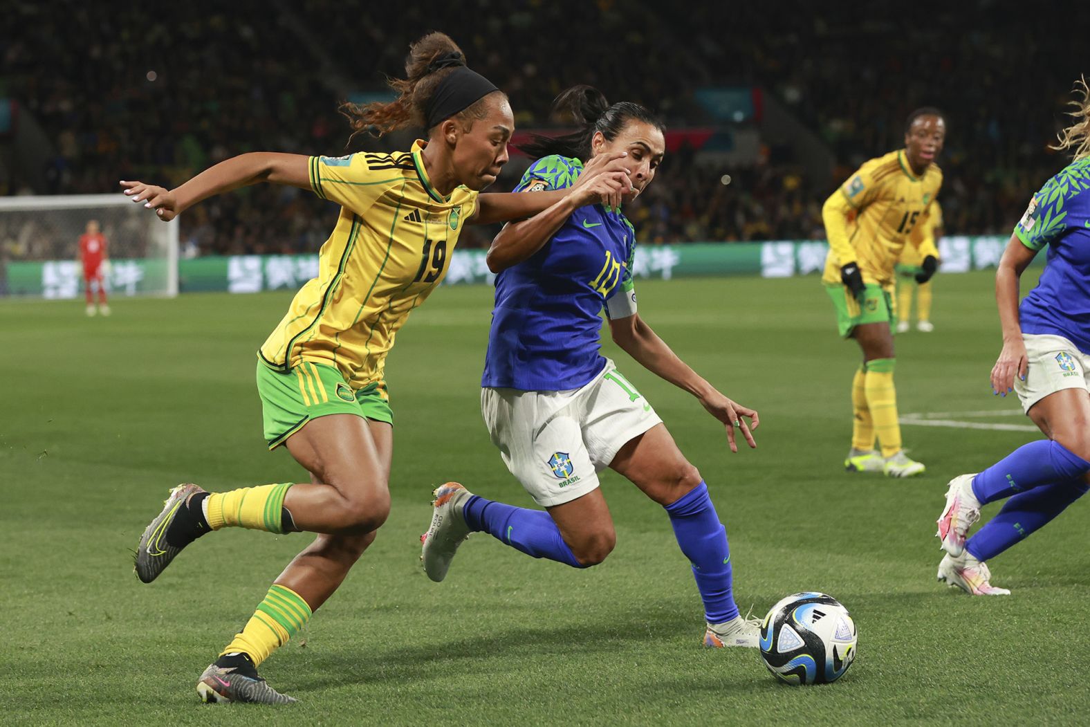 Brazil's Marta, right, competes against Jamaica's Tiernny Wiltshire on August 2. <a href="https://www.cnn.com/2023/08/01/football/brazil-jamaica-france-panama-womens-world-cup-spt-intl/index.html" target="_blank">The two teams drew 0-0</a>, but it was Jamaica that advanced to the knockout stage of the tournament. This was the last World Cup for Marta, the tournament's record scorer and veteran of six tournaments.