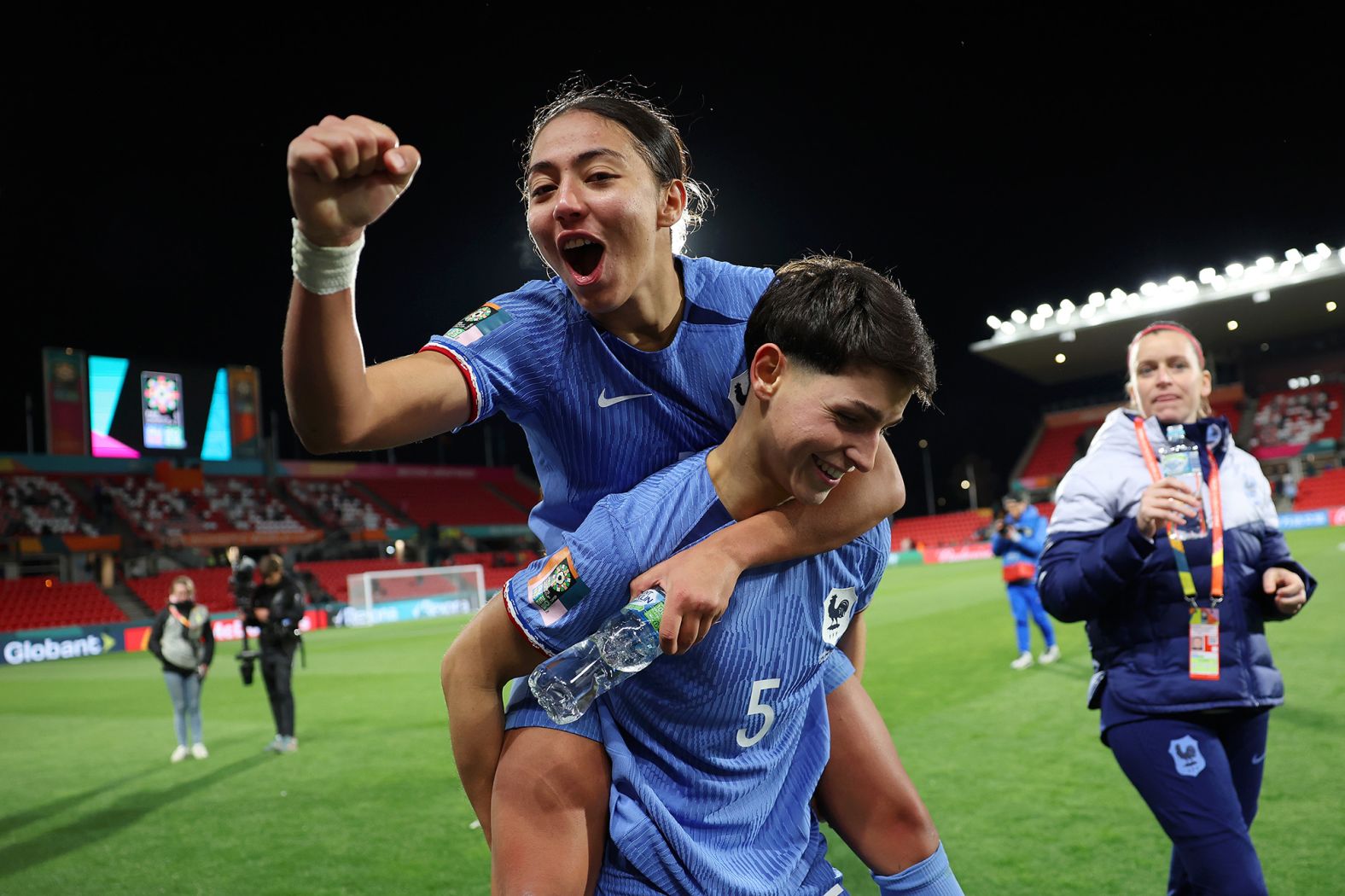 France's Selma Bacha, left, and Élisa De Almeida celebrate after a<a href="https://cnn.com/2023/08/07/football/colombia-jamaica-france-morocco-womens-world-cup-spt-intl/index.html" target="_blank"> 4-0 victory against Morocco</a> in the round of 16.