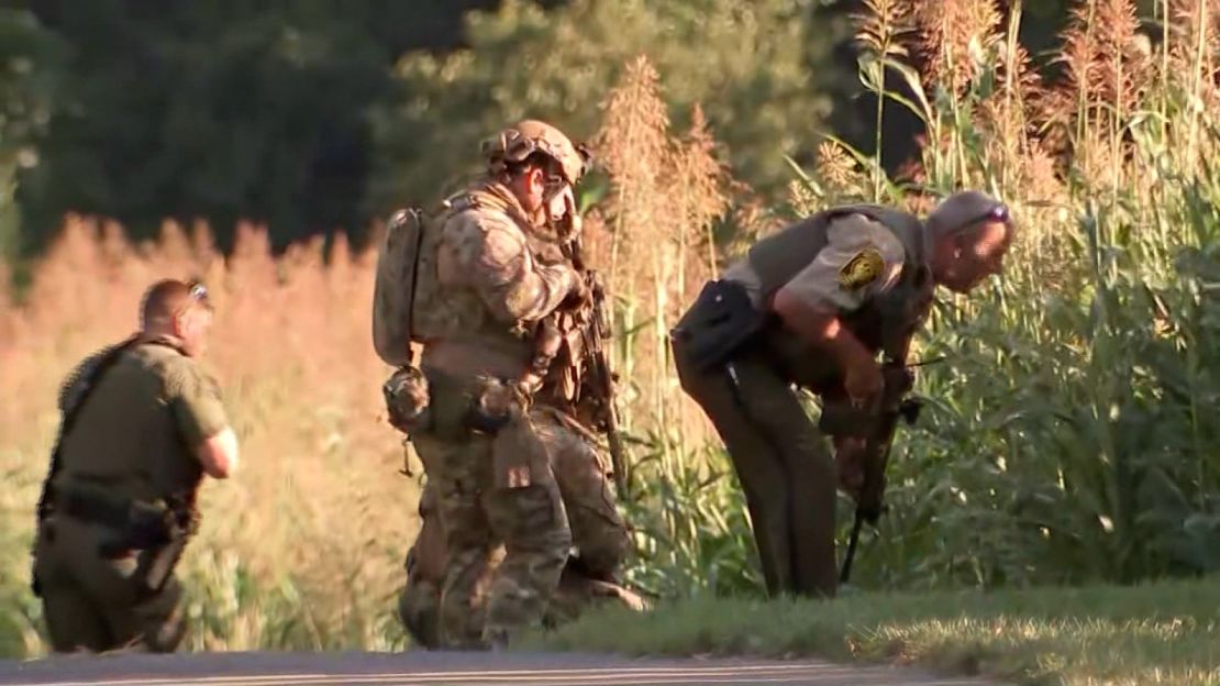 Law enforcement officials search for escaped inmate Danelo Cavalcante.