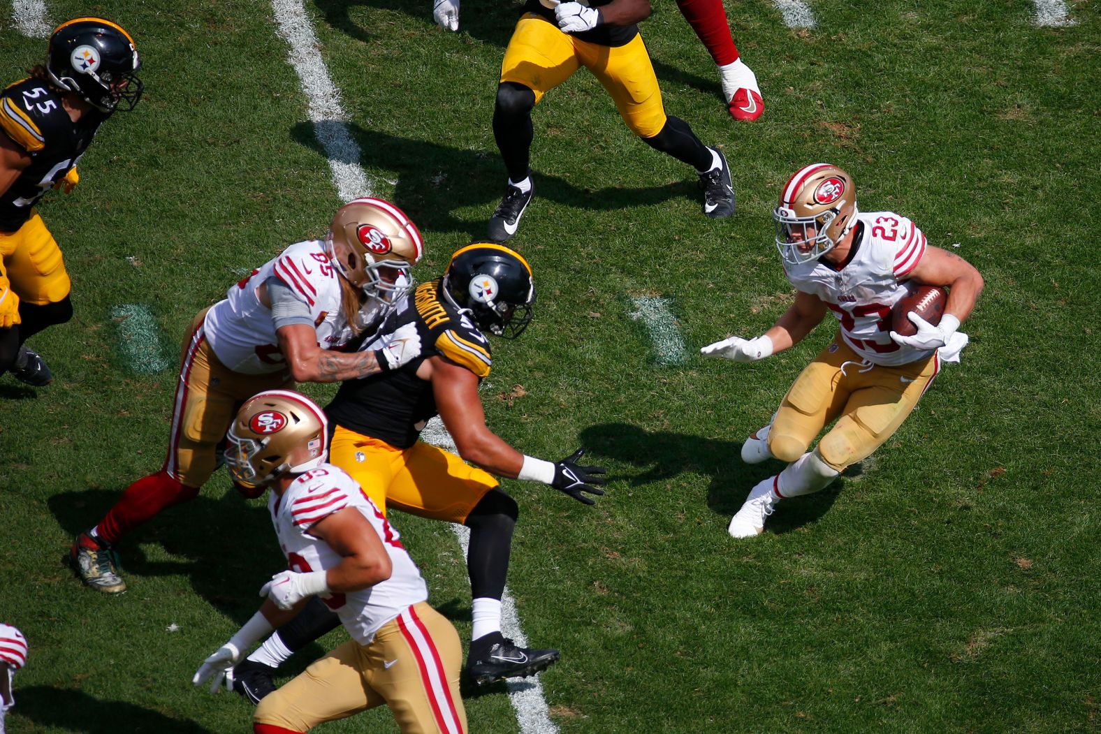 San Francisco 49ers running back Christian McCaffrey looks for space to run the ball in the second half of a 30-7 win over the Pittsburgh Steelers at Acrisure Stadium in Pittsburgh on Sunday, September 10.