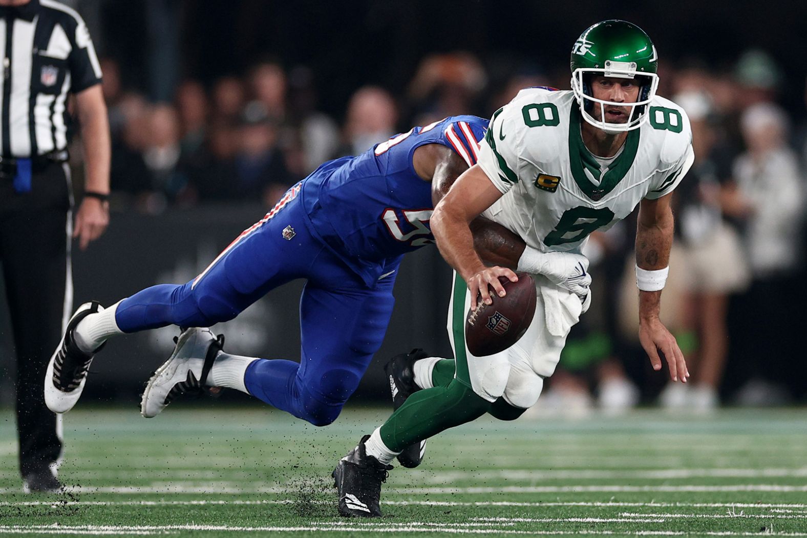 Quarterback Aaron Rodgers, making his debut with the New York Jets, is sacked by Buffalo Bills defensive end Leonard Floyd on Monday, September 11. Rodgers <a href="https://www.cnn.com/2023/09/11/sport/nfl-aaron-rodgers-injury-spt-intl/index.html" target="_blank">suffered an ankle injury</a> and was carted off the field after the play, which occurred during the team's first drive in the first quarter. Before being traded in the offseason, Rodgers had spent the first 18 seasons of his NFL career with the Green Bay Packers.