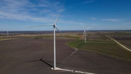 An aerial view shows wind turbines during a tour for the dedication of the Limestone Wind Project in Dawson, Texas, on February 28, 2023. (Photo by Mark Felix / AFP) (Photo by MARK FELIX/AFP /AFP via Getty Images)