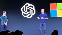 File - Sam Altman, left, appears onstage with Microsoft CEO Satya Nadella at OpenAI's first developer conference, on Nov. 6, 2023, in San Francisco. Microsoft snapped up Altman for a new venture after his sudden departure from OpenAI shocked the artificial intelligence world. (AP Photo/Barbara Ortutay, File)