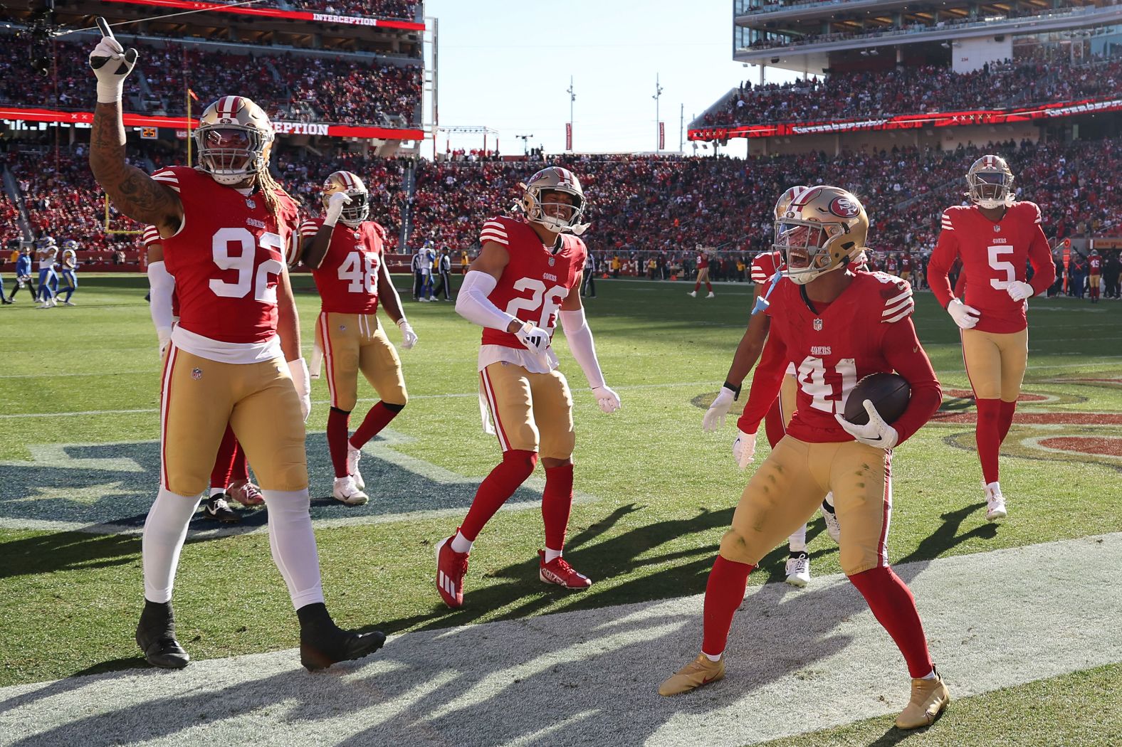 San Francisco 49ers safety Tayler Hawkins celebrates with teammates after an interception on January 7. The 49ers went on to lose 21-20 to the Los Angeles Rams, but they already had the No. 1 seed locked up in the NFC. The Rams were already set as a wild-card team.