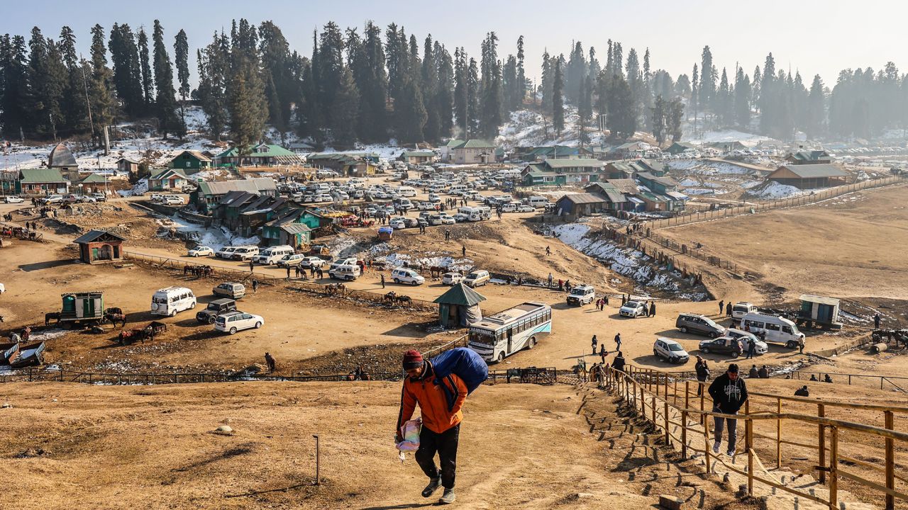 Mandatory Credit: Photo by Nasir Kachroo/NurPhoto/Shutterstock (14294301l)
Vendors are carrying items as they walk towards a temple on a sunny day at the ski resort in Gulmarg, Baramulla, Jammu and Kashmir, India, on January 10, 2024. The Kashmir Valley is experiencing an unprecedented change in weather this winter. Tourist resorts such as Gulmarg, Sonmarg, and Pahalgam would typically be covered with ample snow by now. However, this year, the famous winter ski resort of Kashmir, Gulmarg, is dry with no snowfall. Tourists are saying that they mainly planned their Kashmir tour to witness snowfall and are feeling disappointed this year.
Dry Weather In Kashmir, Gulmarg, India - 10 Jan 2024