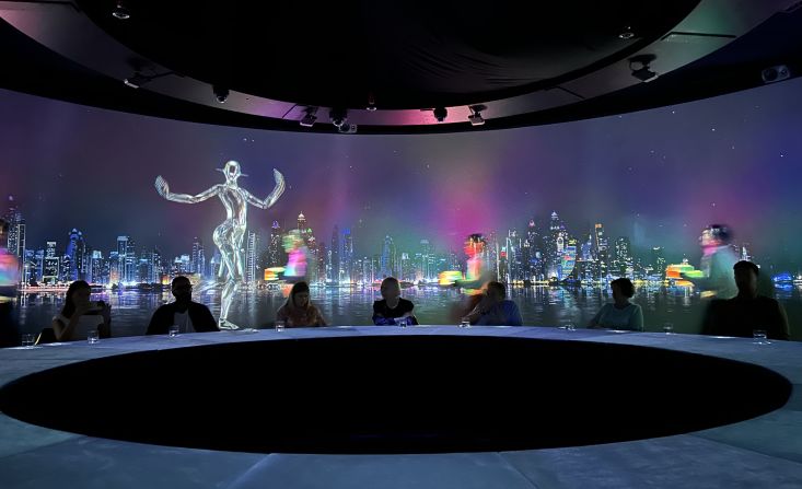To end the experience, diners are brought back to the present: a nighttime skyline of Dubai is projected around the room, as a robot tangos to slow music.  
