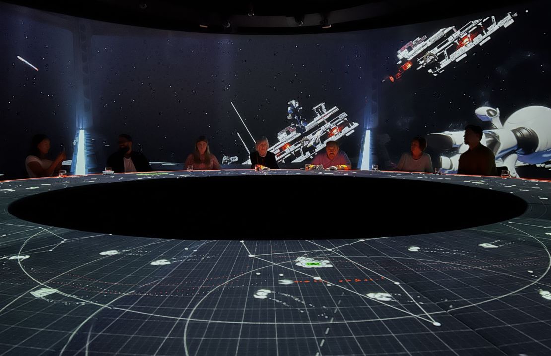 Some courses have interactive gaming elements — such as the space scenarios, where AI-enabled projectors track diners' hands on the table while they "shoot" passing spaceships in an arcade-style game.