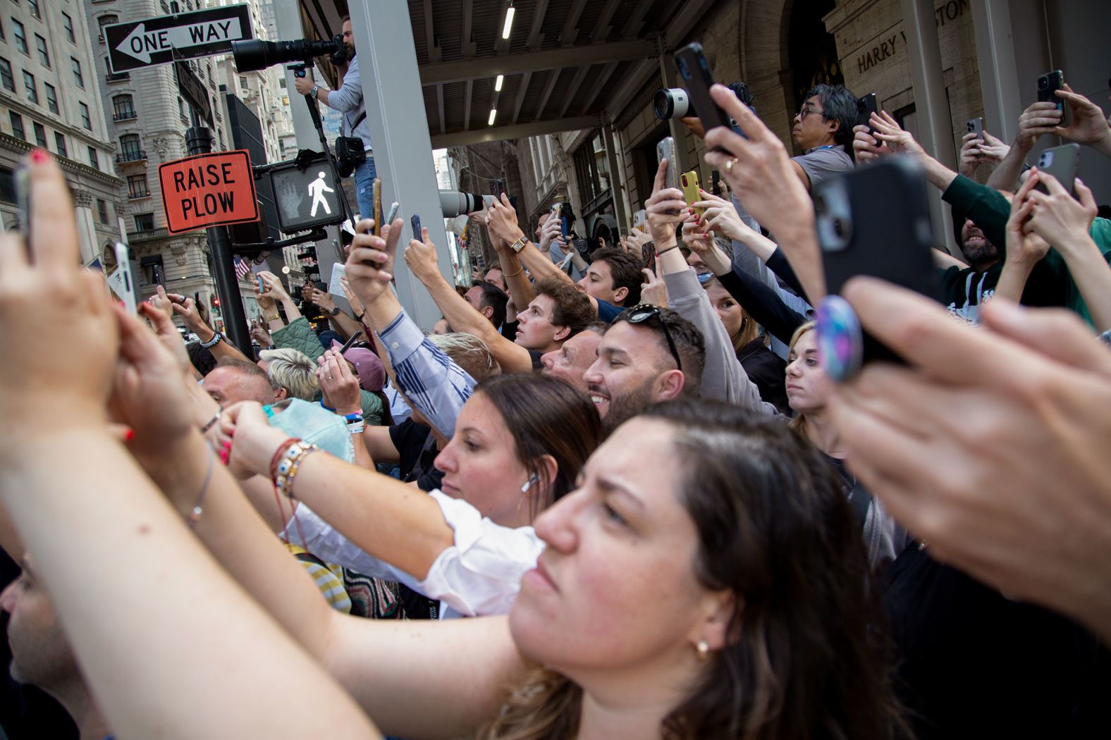 Bystanders try to catch a glimpse of Trump as he enters Trump Tower in New York after his conviction.