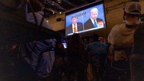 Patrons watch the CNN presidential debate during a watch party at Union Pub in Washington, DC on June 27, 2024. The debate, held in Atlanta, Georgia, marks the first in-person showdown between President Joe Biden and former President Donald Trump of the 2024 election cycle.