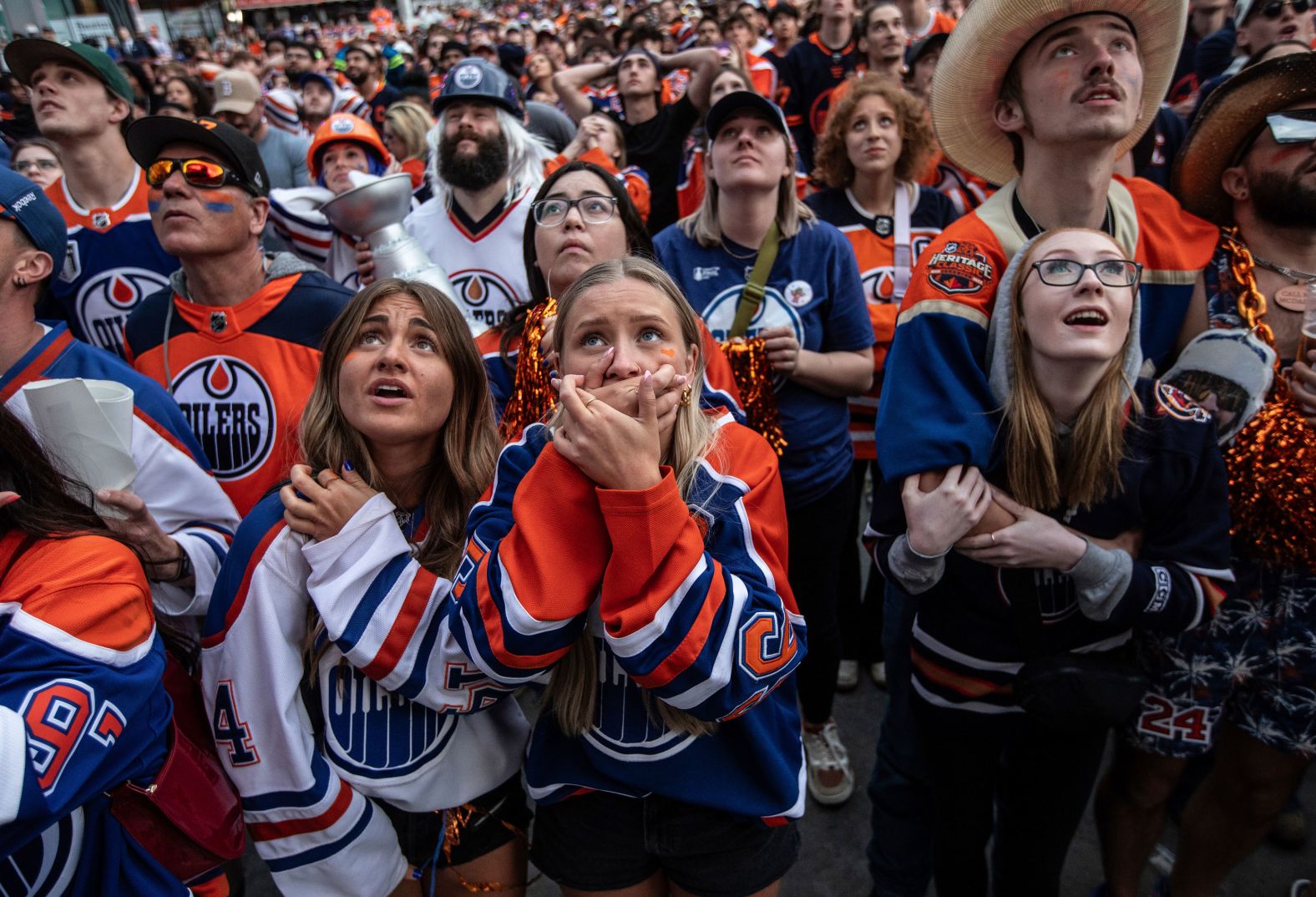 Fans of the Edmonton Oilers, attending a watch party in Edmonton, Alberta, react after their team lost Game 7 of the Stanley Cup Final on Monday, June 24.