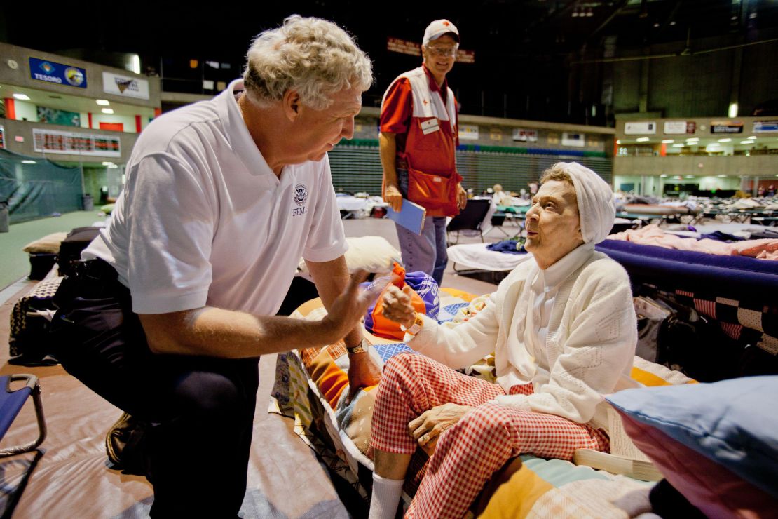 2KYDJK6 Flooding - Minot, N. D. , June 29, 2011 Richard Serino, Federal Emergency Management Agency (FEMA) deputy administrator, visits with disaster survivor Dona Young at the Red Cross shelter in Minot, North Dakota. Andrea Booher/FEMA. North Dakota Flooding. Photographs Relating to Disasters and Emergency Management Programs, Activities, and Officials