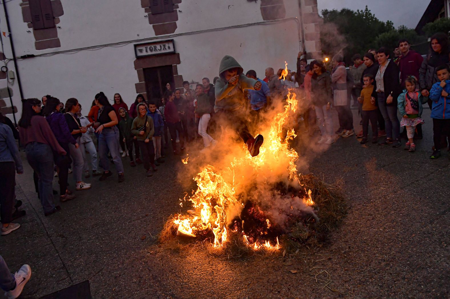 A boy jumps over a fire in Arisku, Spain, on Sunday, June 23. It was the night of San Juan, an ancient tradition that welcomes the summer season and is celebrated in various towns in Spain.