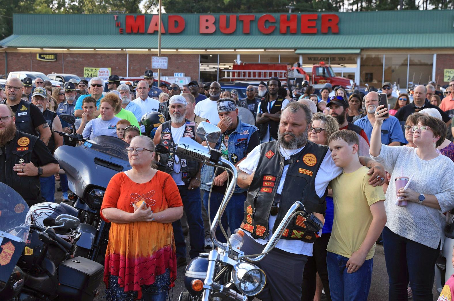 Mourners gather in the parking lot of the Mad Butcher grocery store for a candlelight vigil honoring the victims of a <a href="https://www.cnn.com/2024/06/22/us/fordyce-arkansas-grocery-store-shooting-saturday/index.html">mass shooting</a> in Fordyce, Arkansas, on Sunday, June 23. Four people were killed and nine were wounded. The suspected shooter was also wounded and taken into custody.