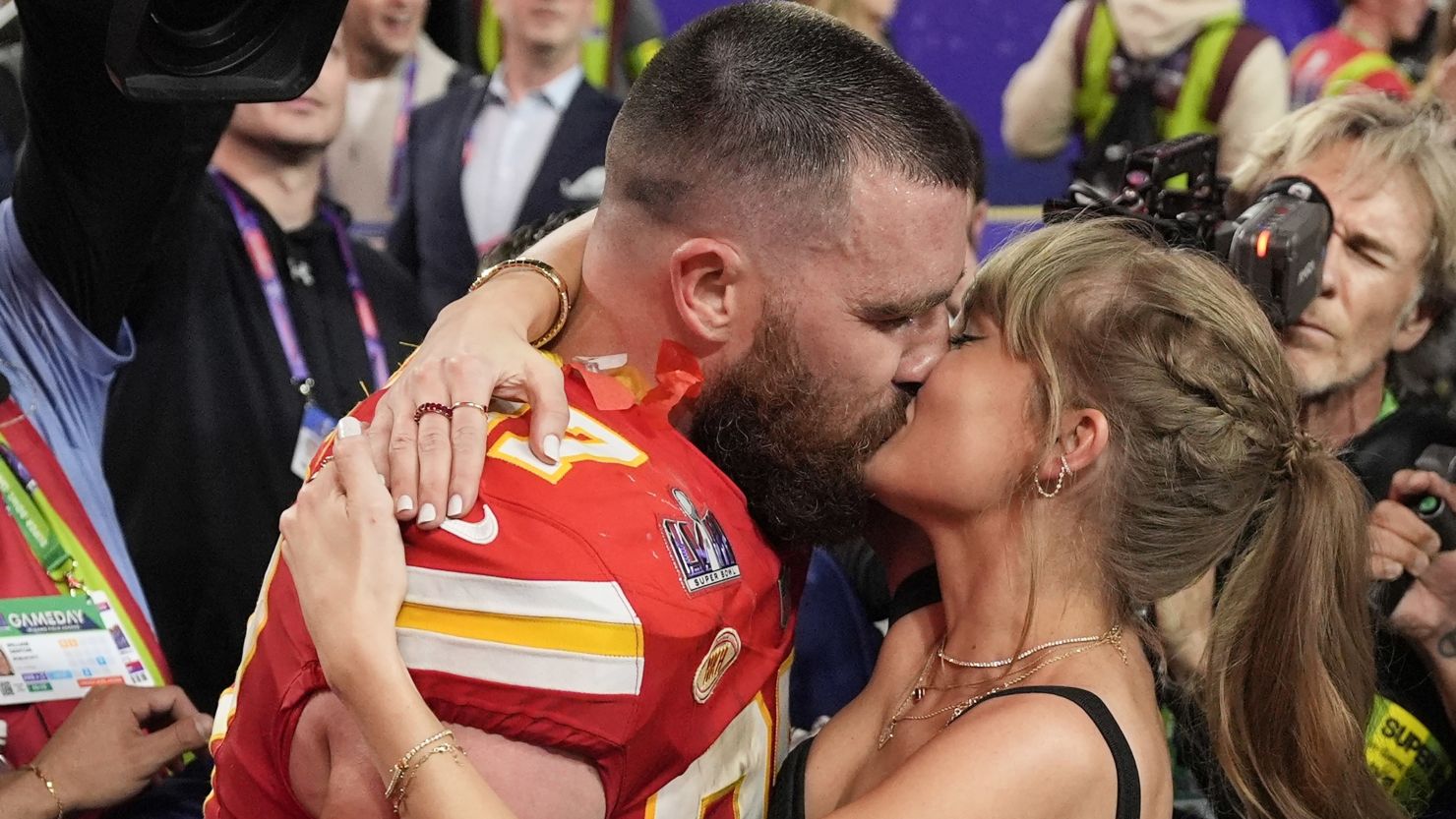 (From left) Travis Kelce kisses Taylor Swift on the field at Arrowhead Stadium after the Kansas City Chiefs beat the San Fransisco 49ers in the 2024 Super Bowl.