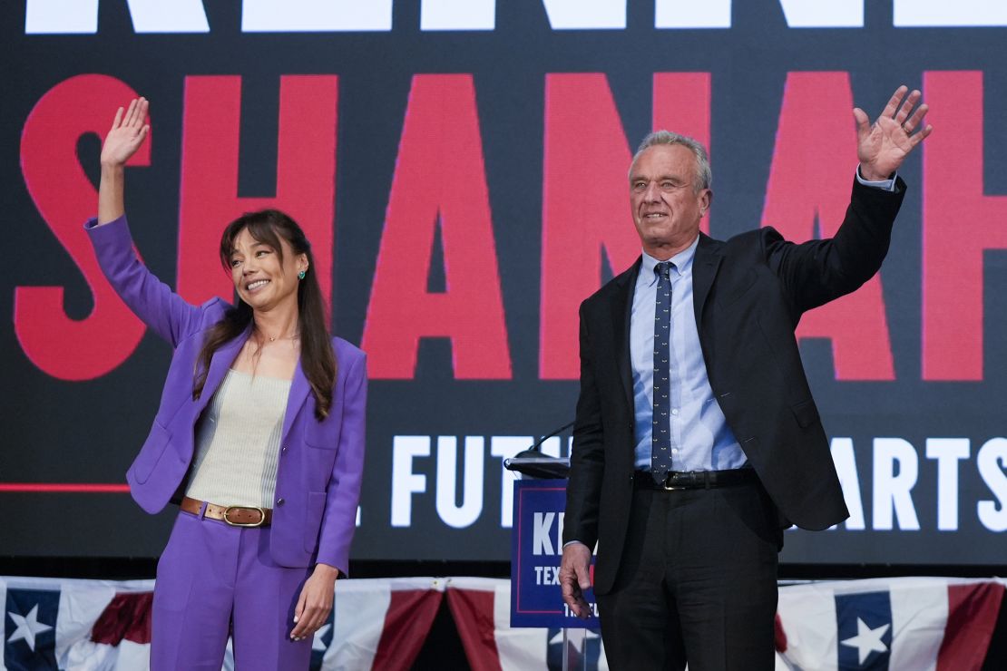 Presidential candidate Robert F. Kennedy Jr. right, waves on stage with Nicole Shanahan, after announcing her as his running mate, during a campaign event, Tuesday, March 26, 2024, in Oakland, Calif. (AP Photo/Eric Risberg)